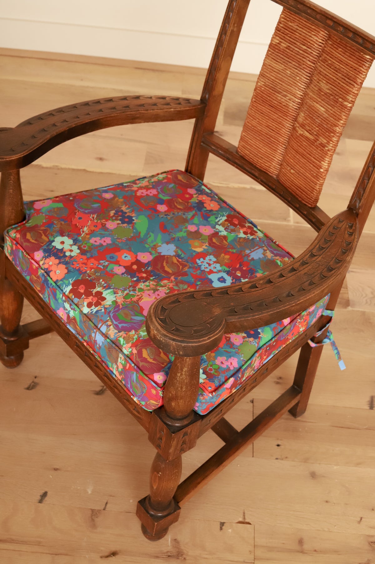 French Basque armchair in Kristy Stafford Textiles, carved arm and cushion detail