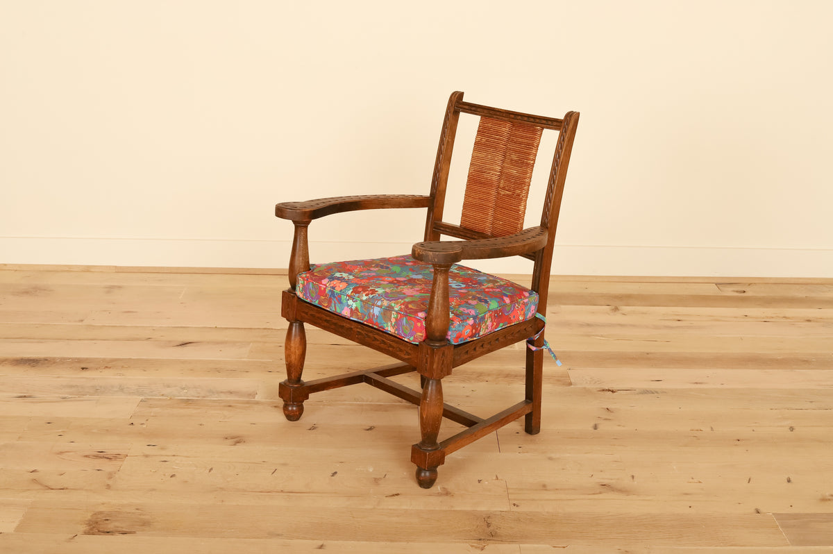 French Basque armchair with rush back in Kristy Stafford Textiles, three-quarter view