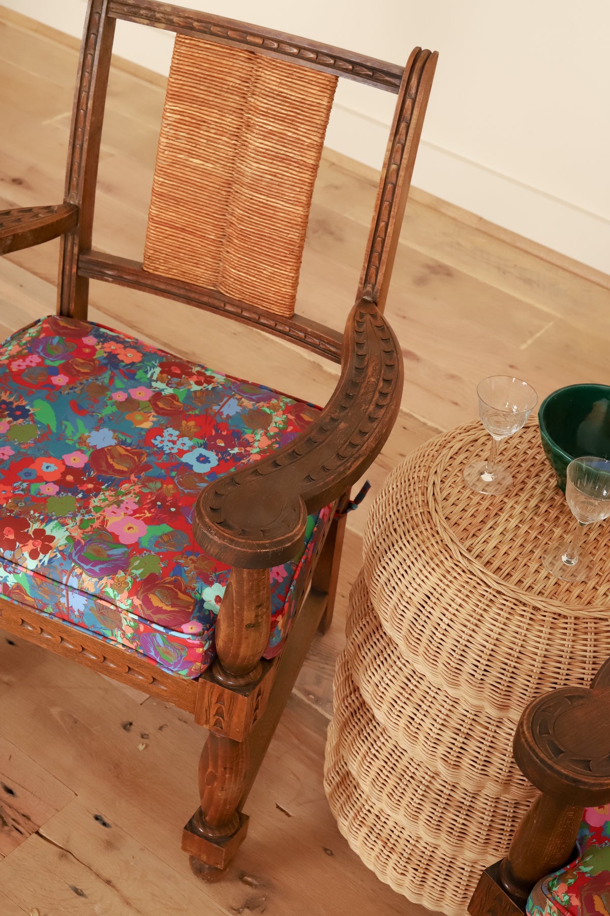French Basque armchair in Kristy Stafford Textiles, styled with a rattan side table