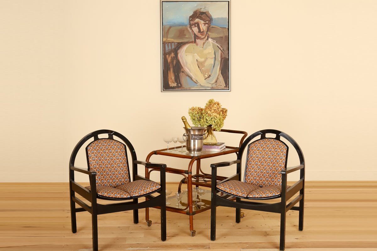 Pair of black lacquered Baumann armchairs in Leah O'Connell Textiles, front