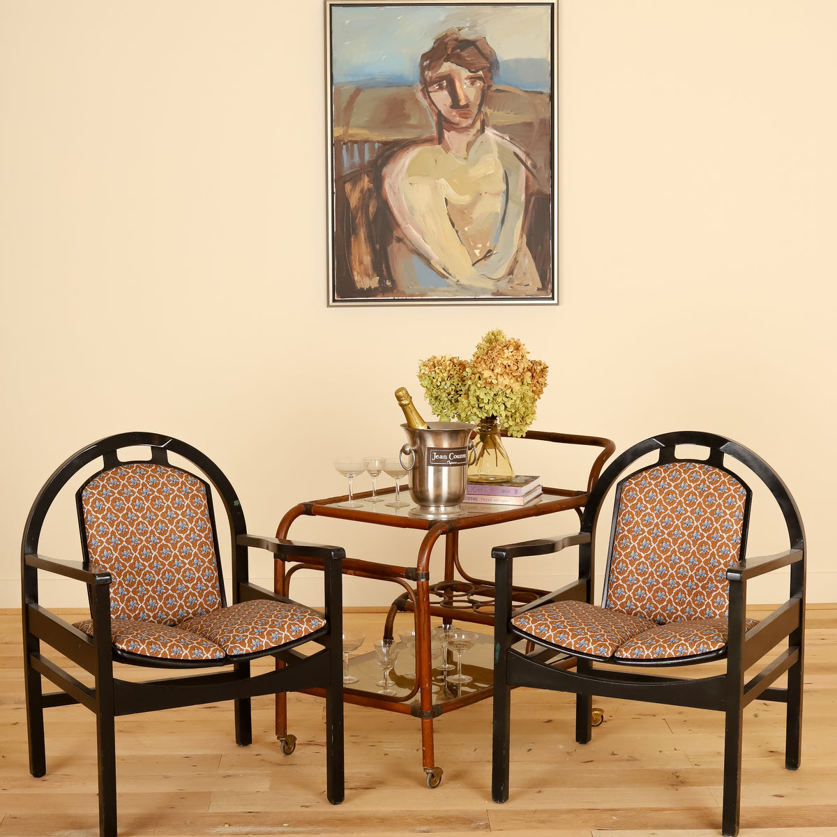Pair of black lacquered Baumann armchairs in Leah O'Connell Textiles, front