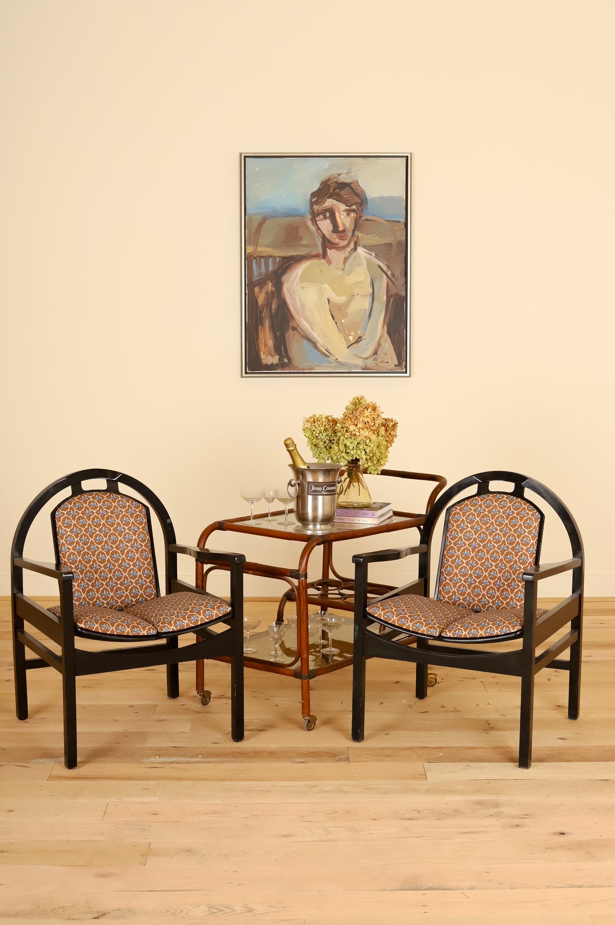 Pair of black lacquered Baumann armchairs in Leah O'Connell Textiles, styled