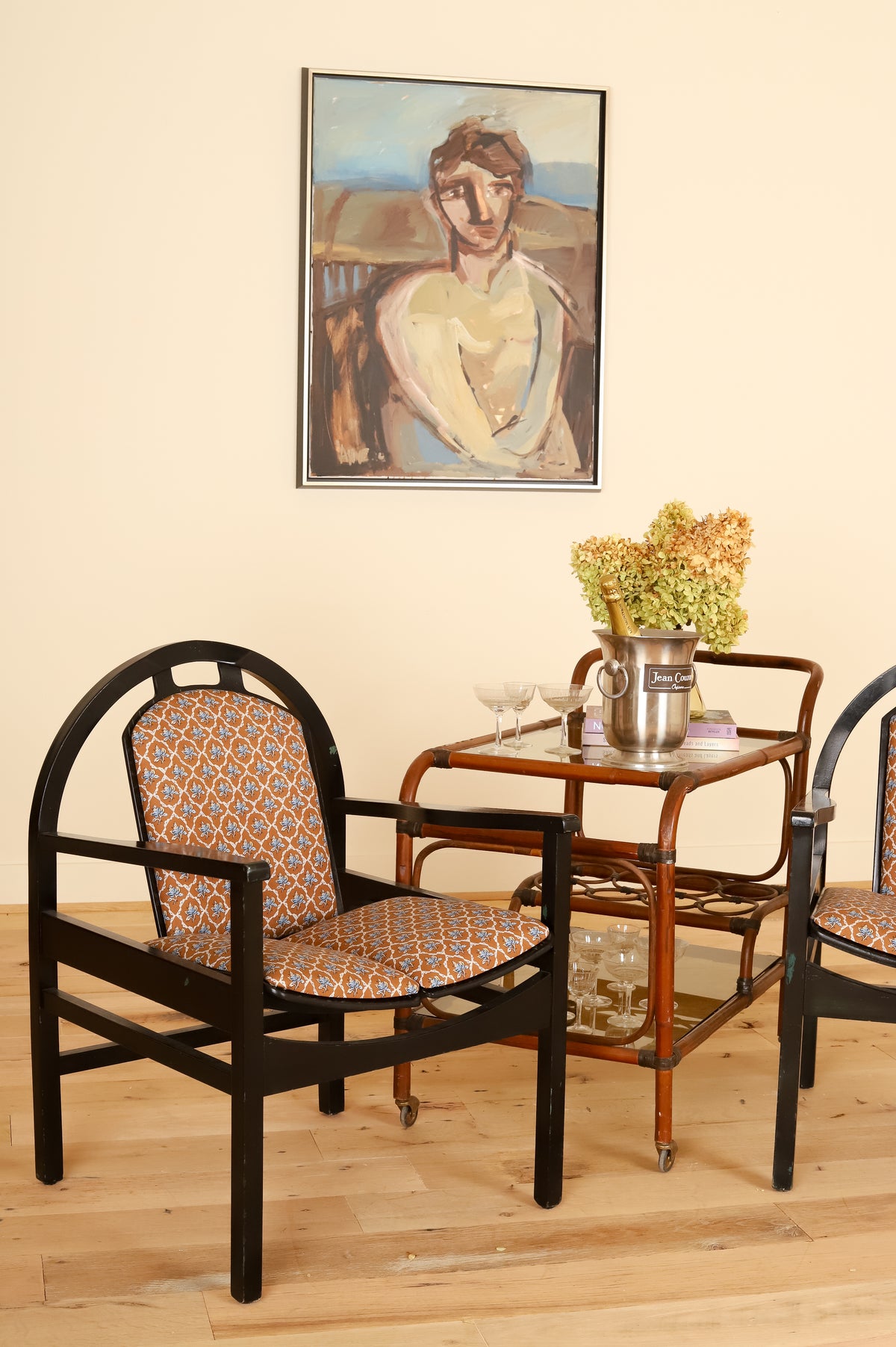 Pair of black lacquered Baumann armchairs in Leah O'Connell Textiles, styled
