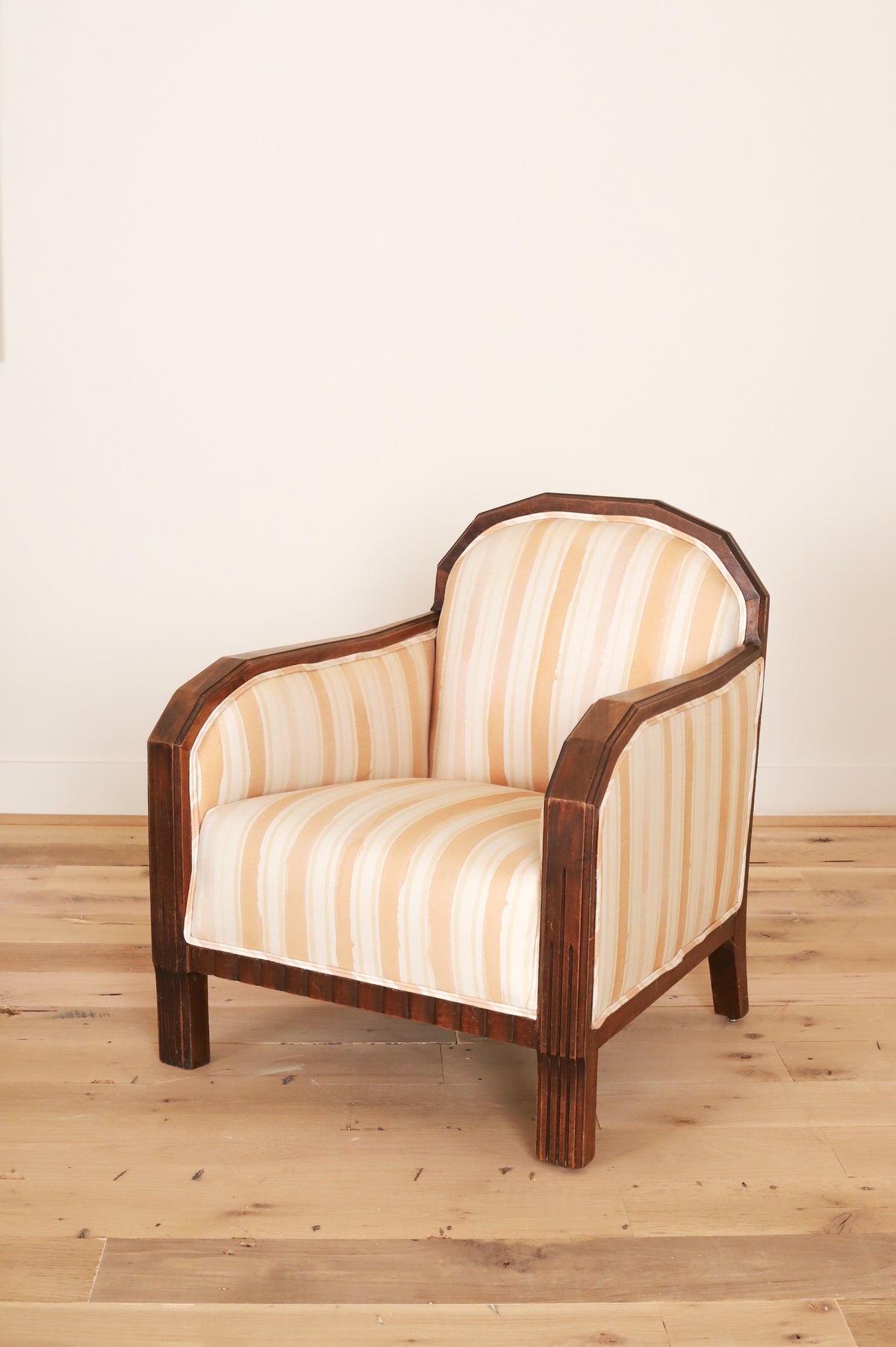 French Art Deco club chair in Work + Sea terracotta ticking, three-quarter view