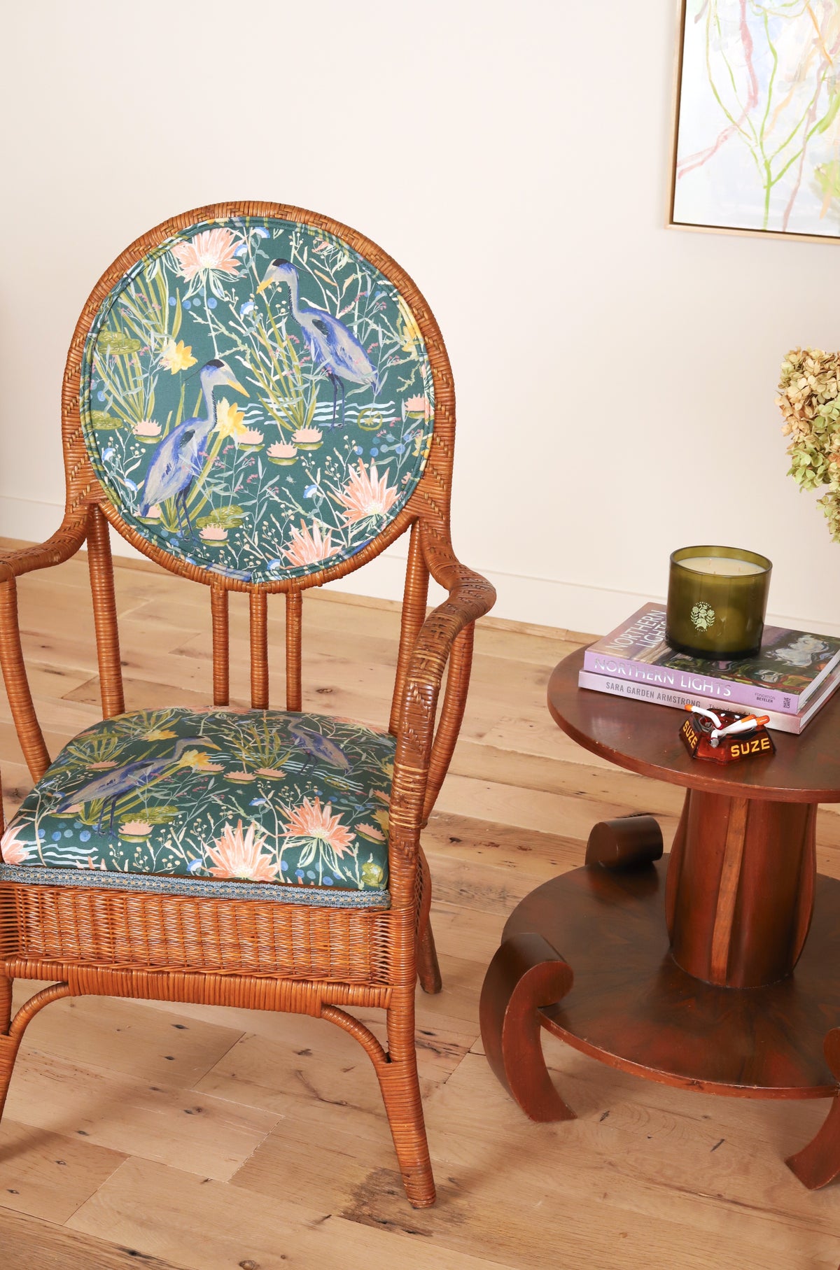 French rattan armchair with heron print upholstery, close view