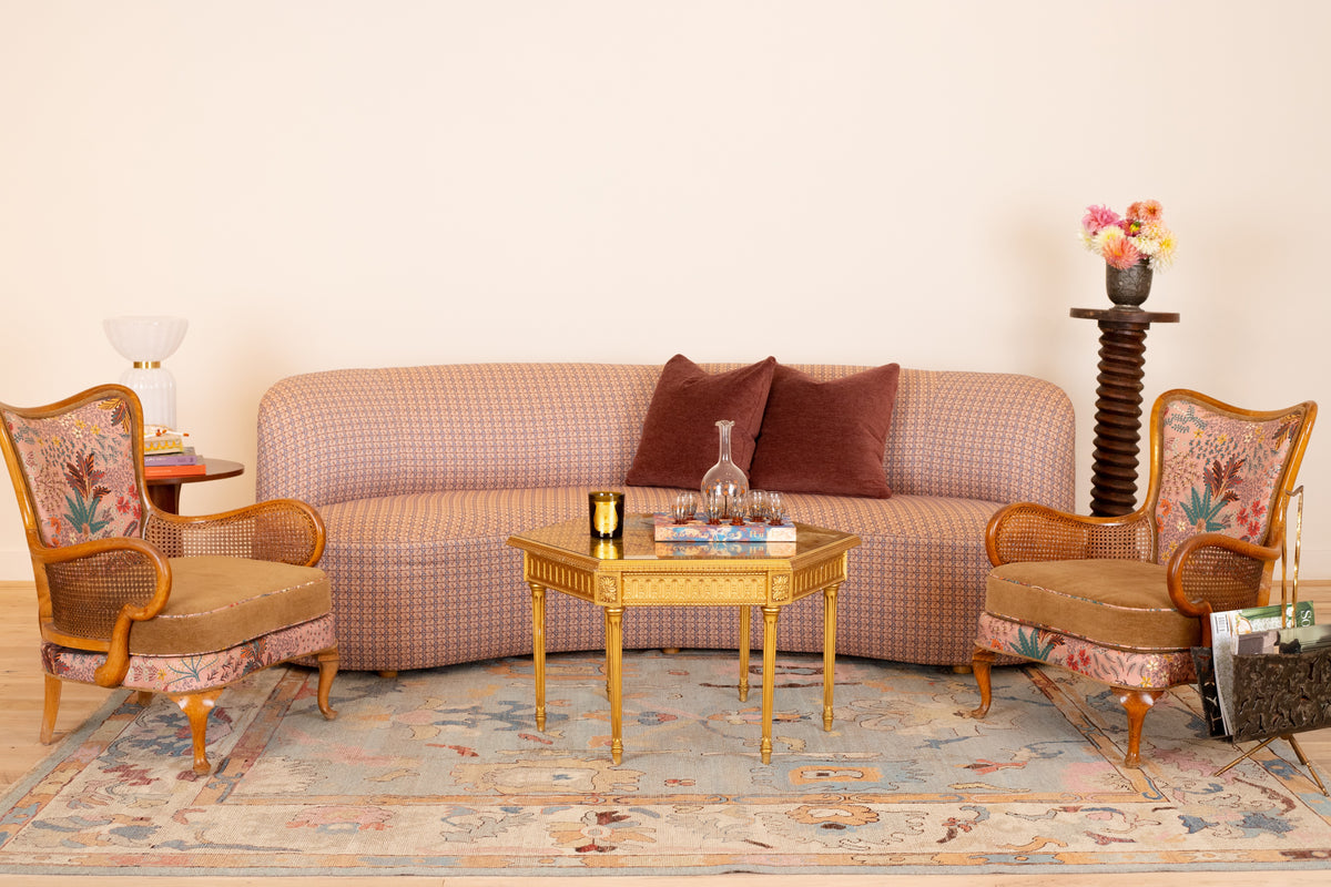 Sophia Sofa in Alex Conroy Textiles Folklore, Rose/Sky, with a pair of cane-arm lounge chairs, styled