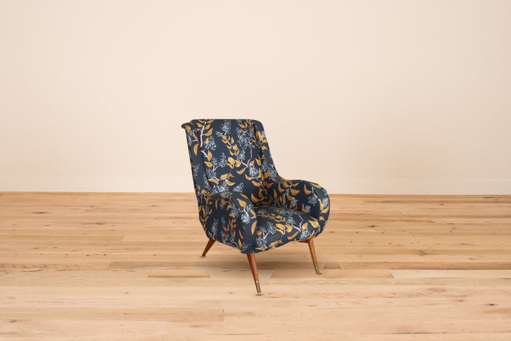 French lounge chair c. 1960 in Lake August Snowbrush Pitch with brass sabots, on a wood floor