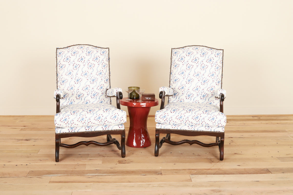 Pair of Louis XIII os-de-mouton armchairs in Fete Home by Jen Potter, styled