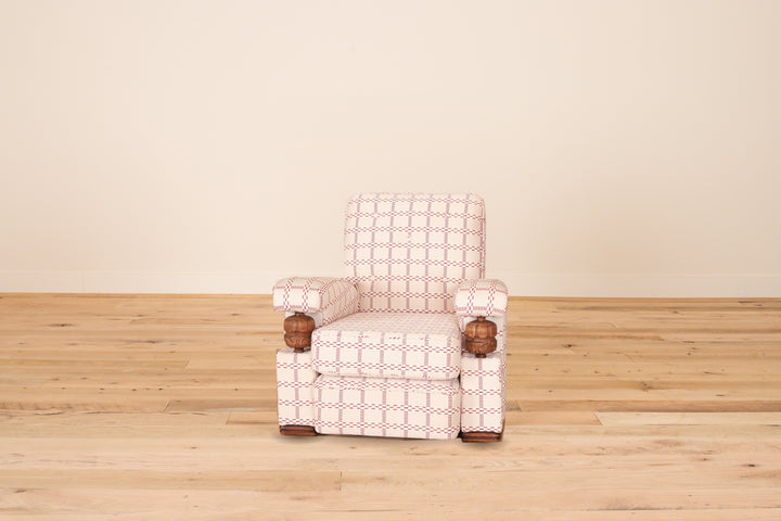 French club chair c. 1960 with carved wood arm supports in Mally Skok Nantucket, front view on a wood floor