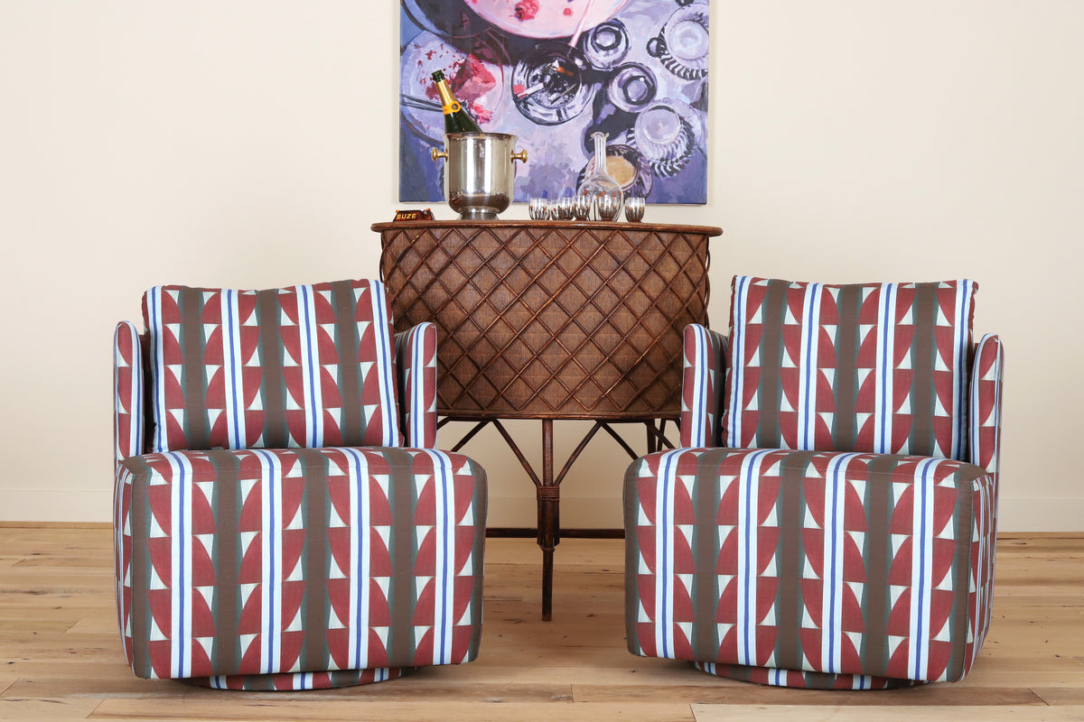 Pair of Montauk Swivel Chairs in Bethany Mabee Granato, front view on a wood floor