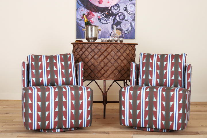 Pair of Montauk Swivel Chairs in Bethany Mabee Granato, front view on a wood floor