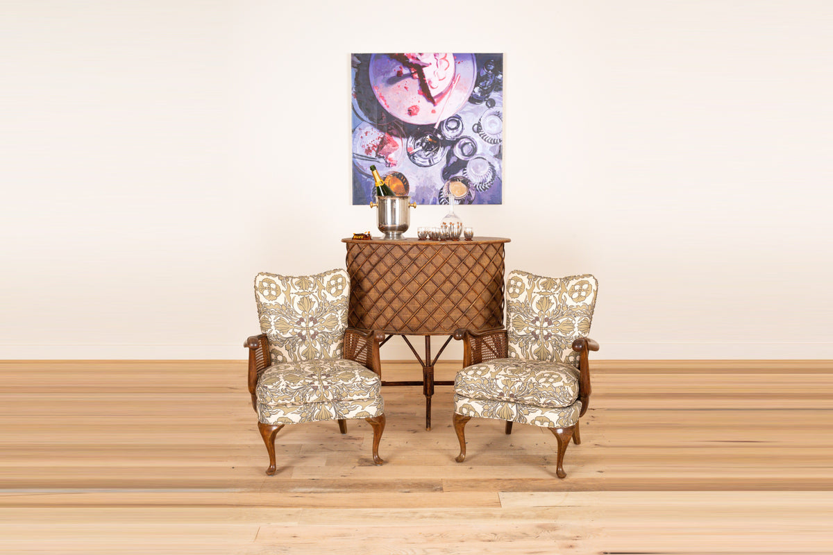 Pair of French sculptural armchairs with cane sides c. 1930 in Otea Vintage Scarf, front view on a wood floor