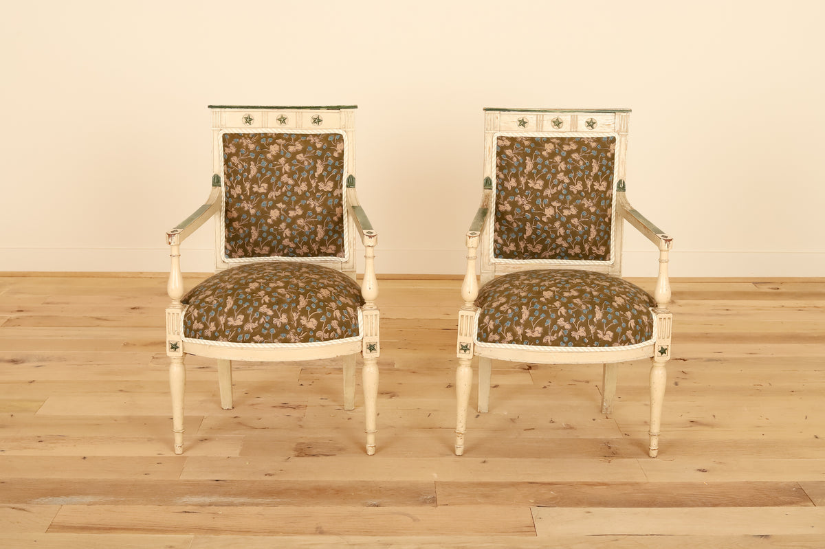 Pair of French painted armchairs with fluted legs in Allem Studio, front view on a wood floor