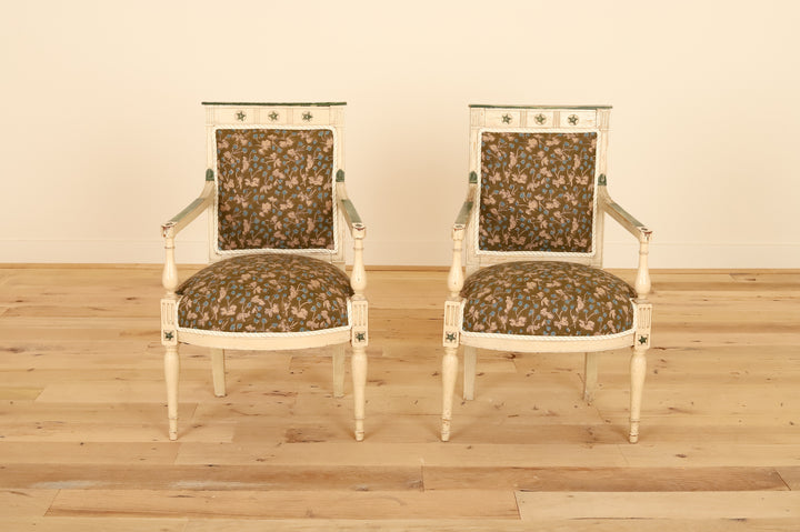 Pair of French painted armchairs with fluted legs in Allem Studio, front view on a wood floor